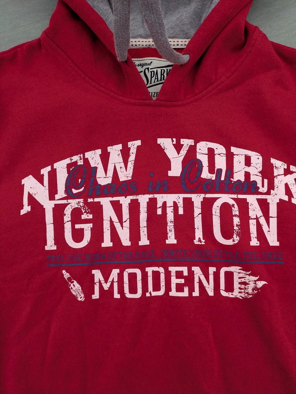 Sparks red zip-through hoodie with New York graphic print and grey hood.
