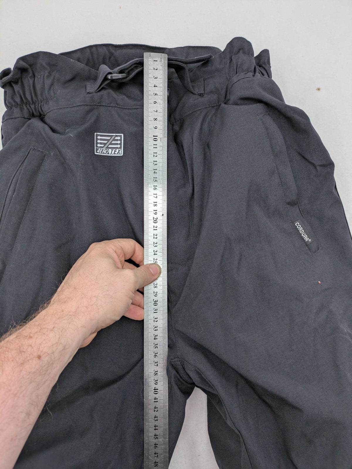 Aero black chaps Cordura fabric with ribbed knee inserts and adjustable waistband.
