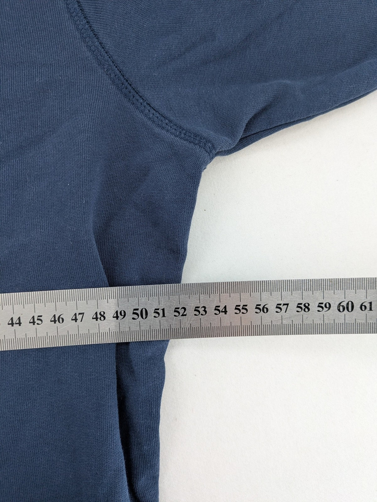 Jack & Jones Core blue hoodie with large gold "C" graphic and high collar.