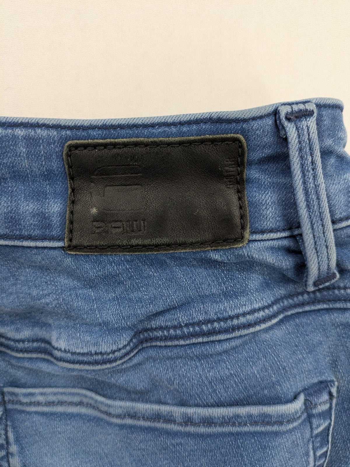 G-Star Raw blue high super skinny jeans with medium wash and logo details.