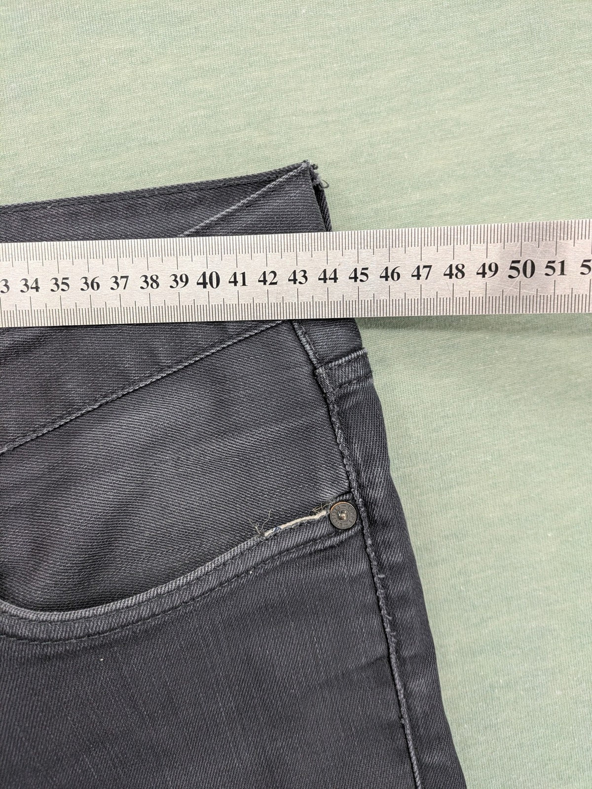 Tommy Hilfiger grey straight jeans faded denim with iconic logo detail.