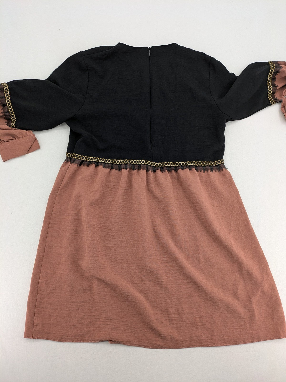 Efsun Moda grey and pink A-line dress with gold decorative chains and long balloon sleeves.