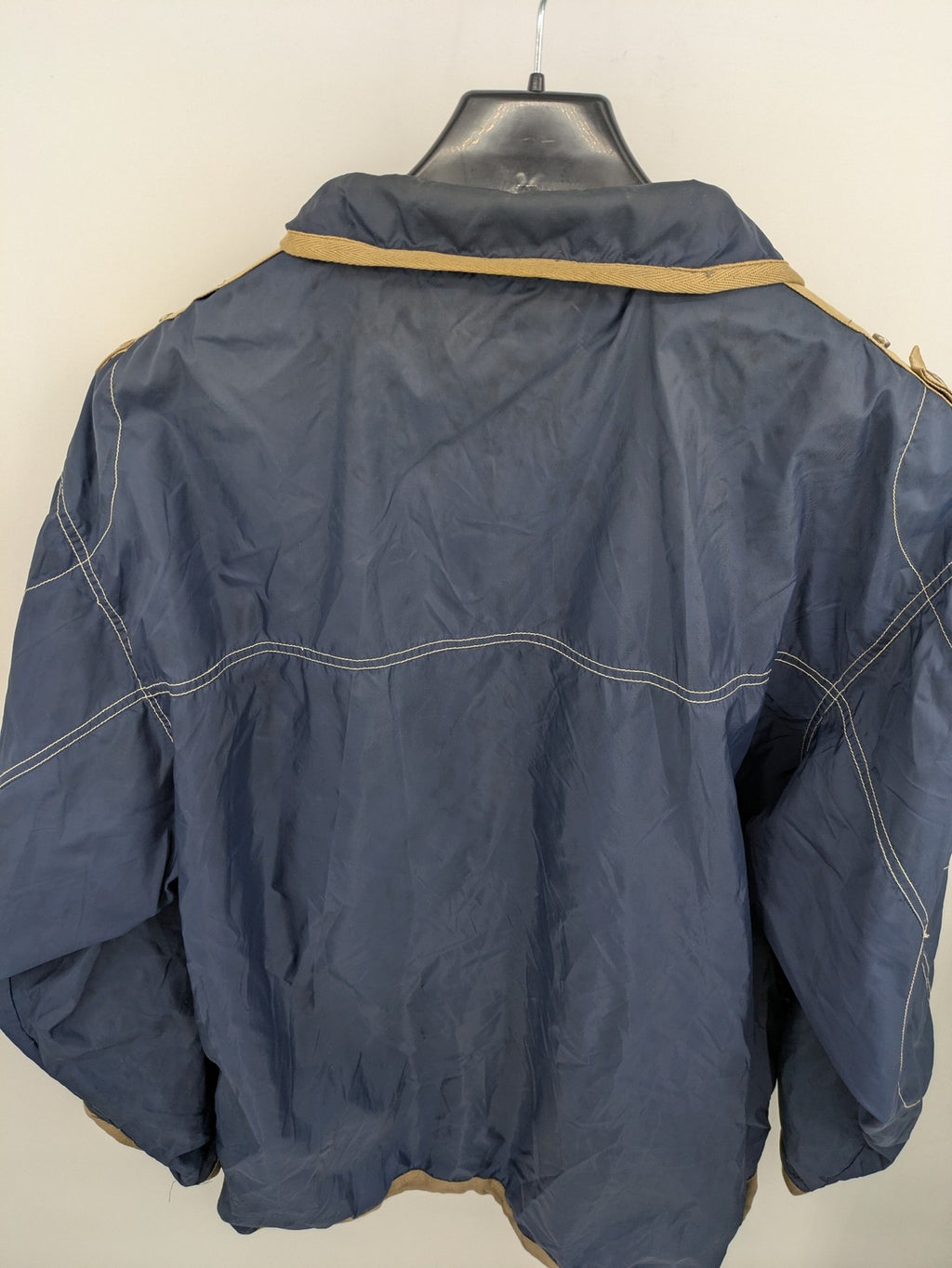 Knock Out navy blue jacket full zip nylon with brown accents and breathable mesh lining.
