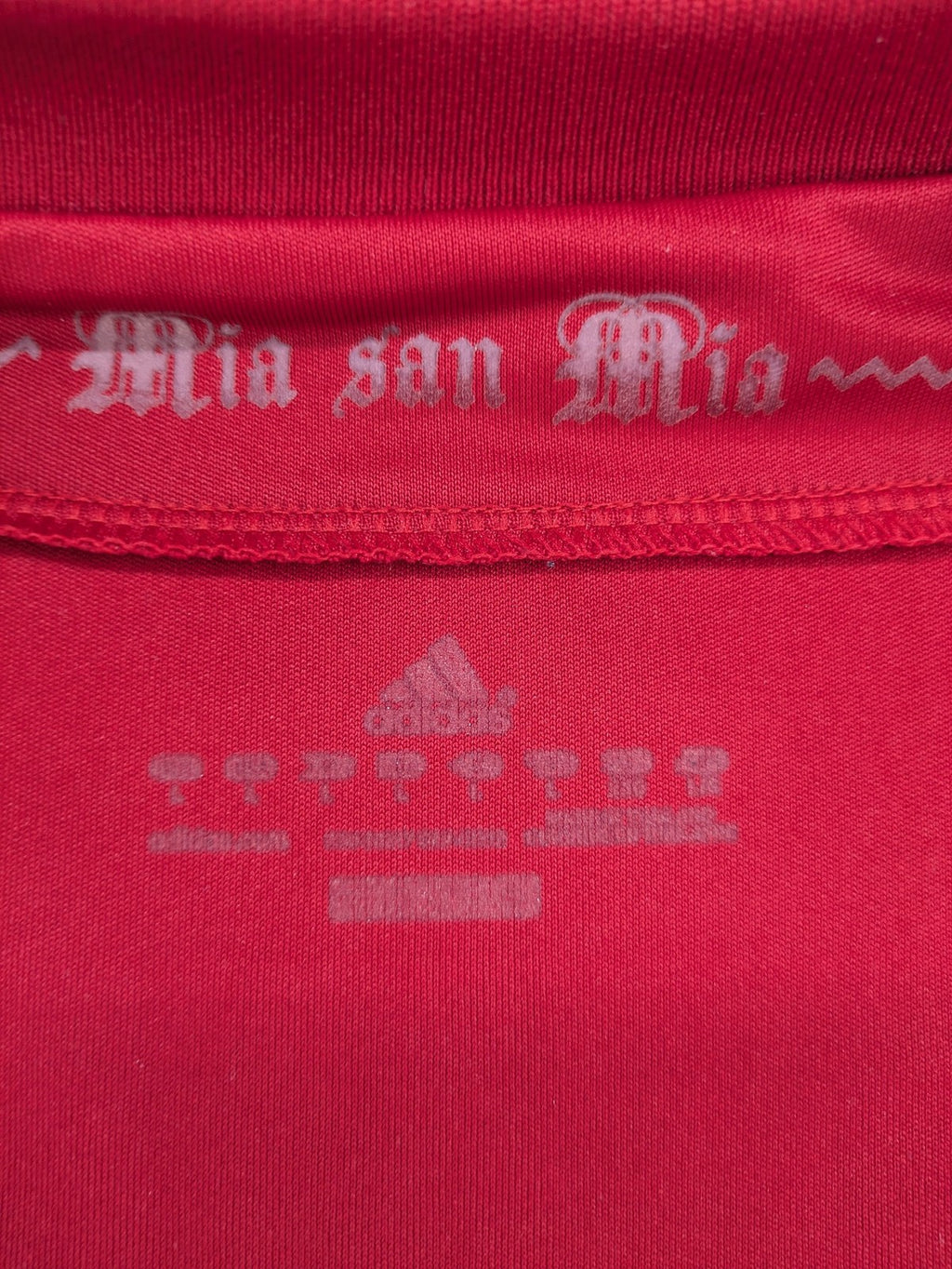 Adidas red soccer uniform with embroidered FC Bayern München crest and T-Mobile logo.
