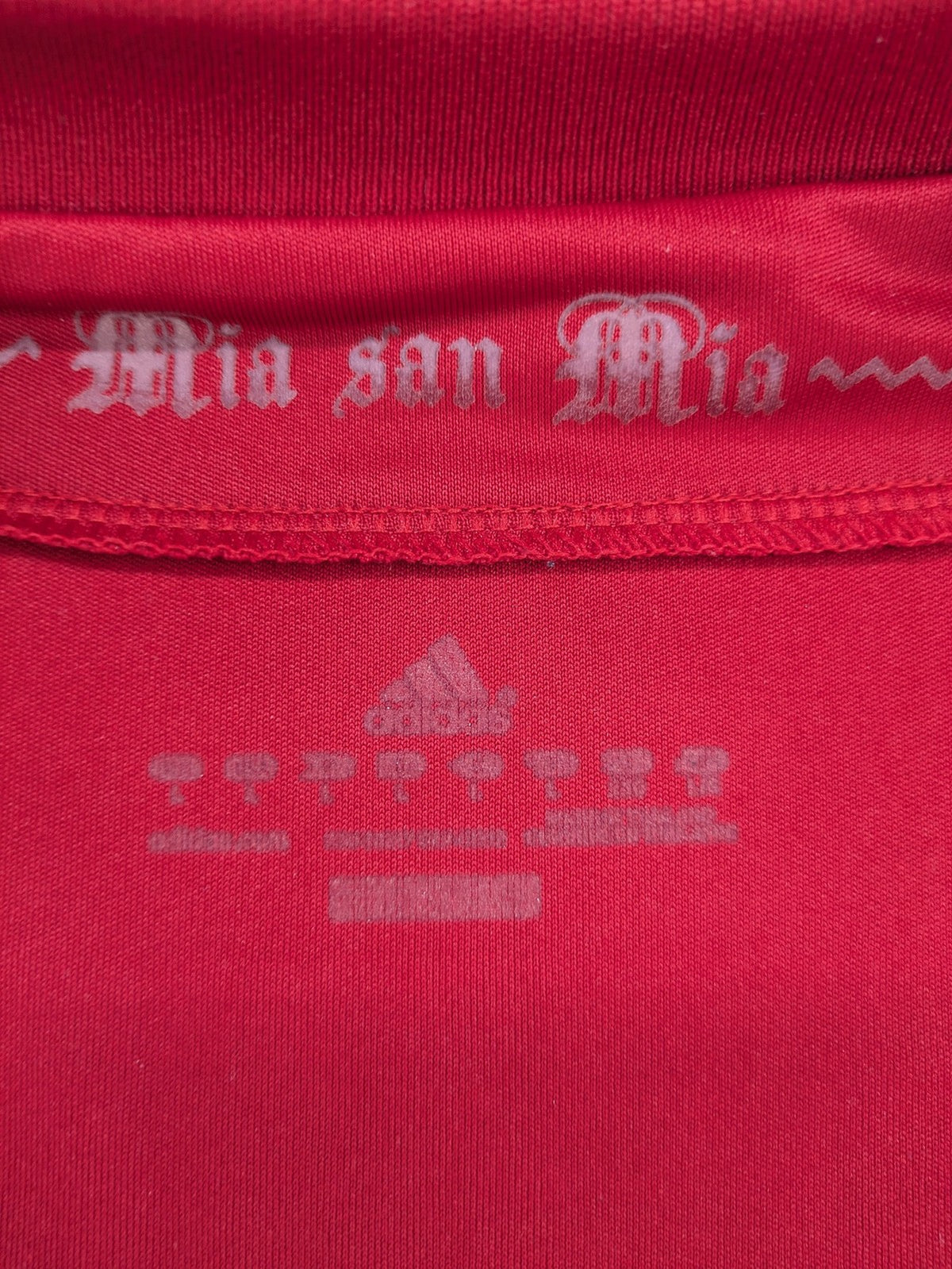 Adidas red soccer uniform with embroidered FC Bayern München crest and T-Mobile logo.