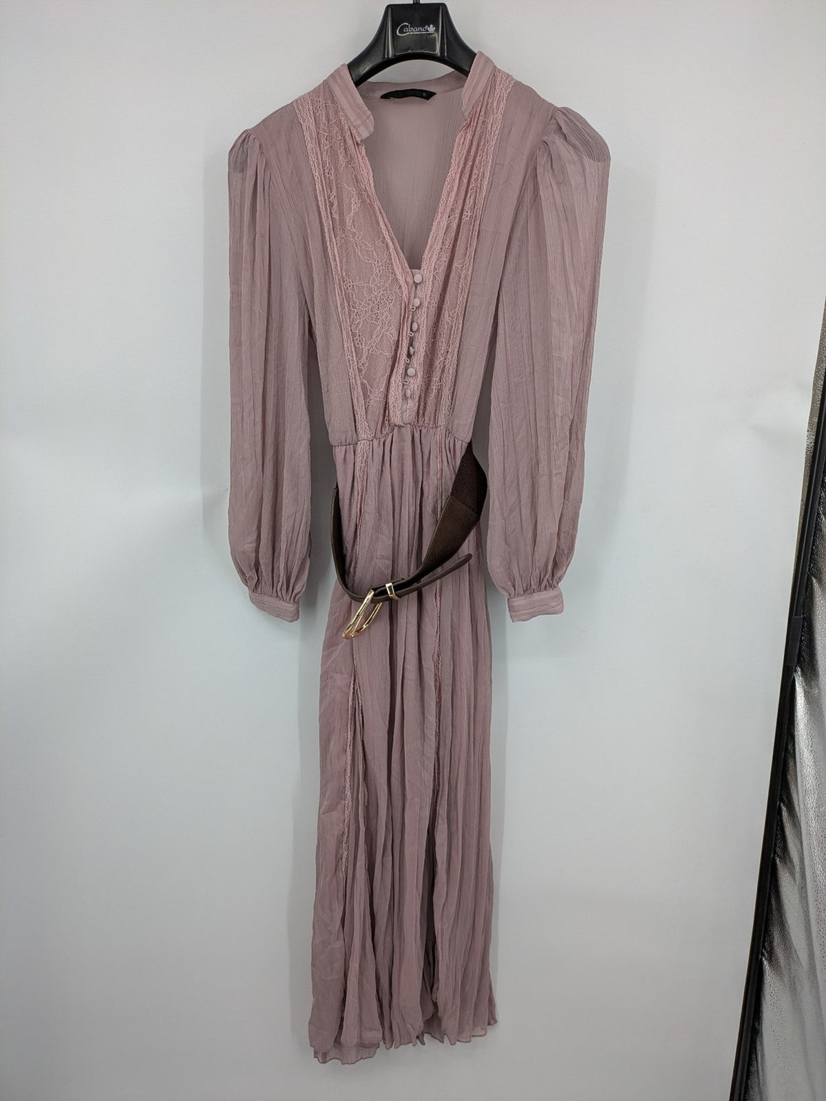 Zara pink midi dress with lace V-neck, pleated fabric, and long bishop sleeves.