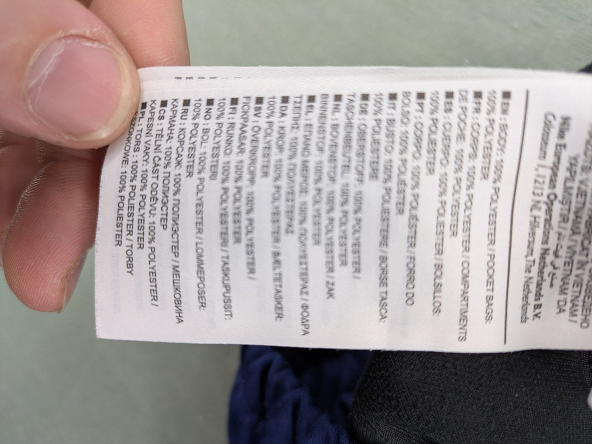Nike Air blue jogging pants with black and white side stripes, elastic waistband.