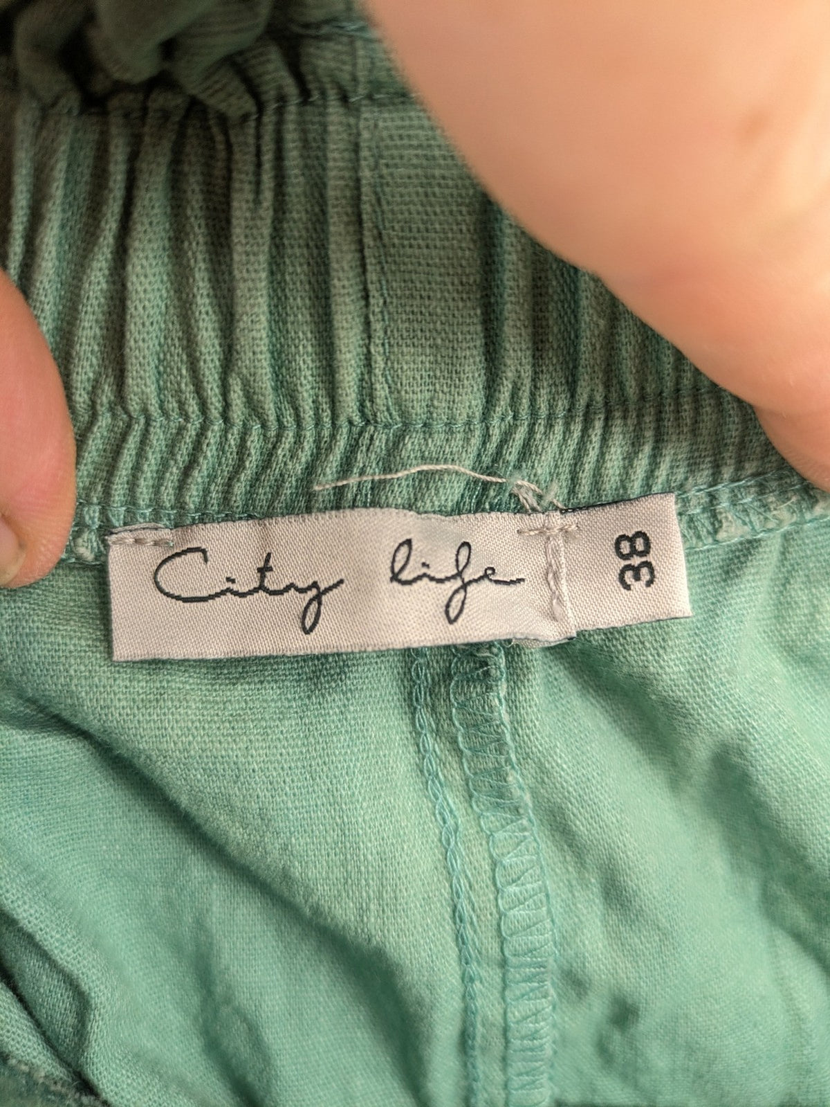City Life pink culotte pants with paperbag waist and matching belt, cotton blend.