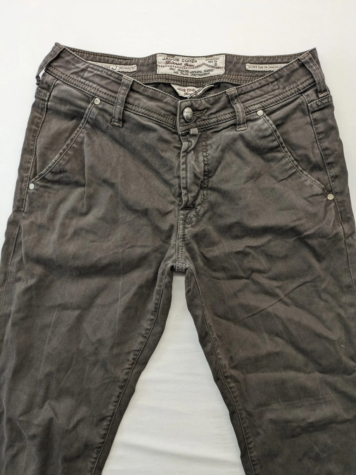 Jacob Cohen black straight jeans with leather logo patch and zip fly, size 32.