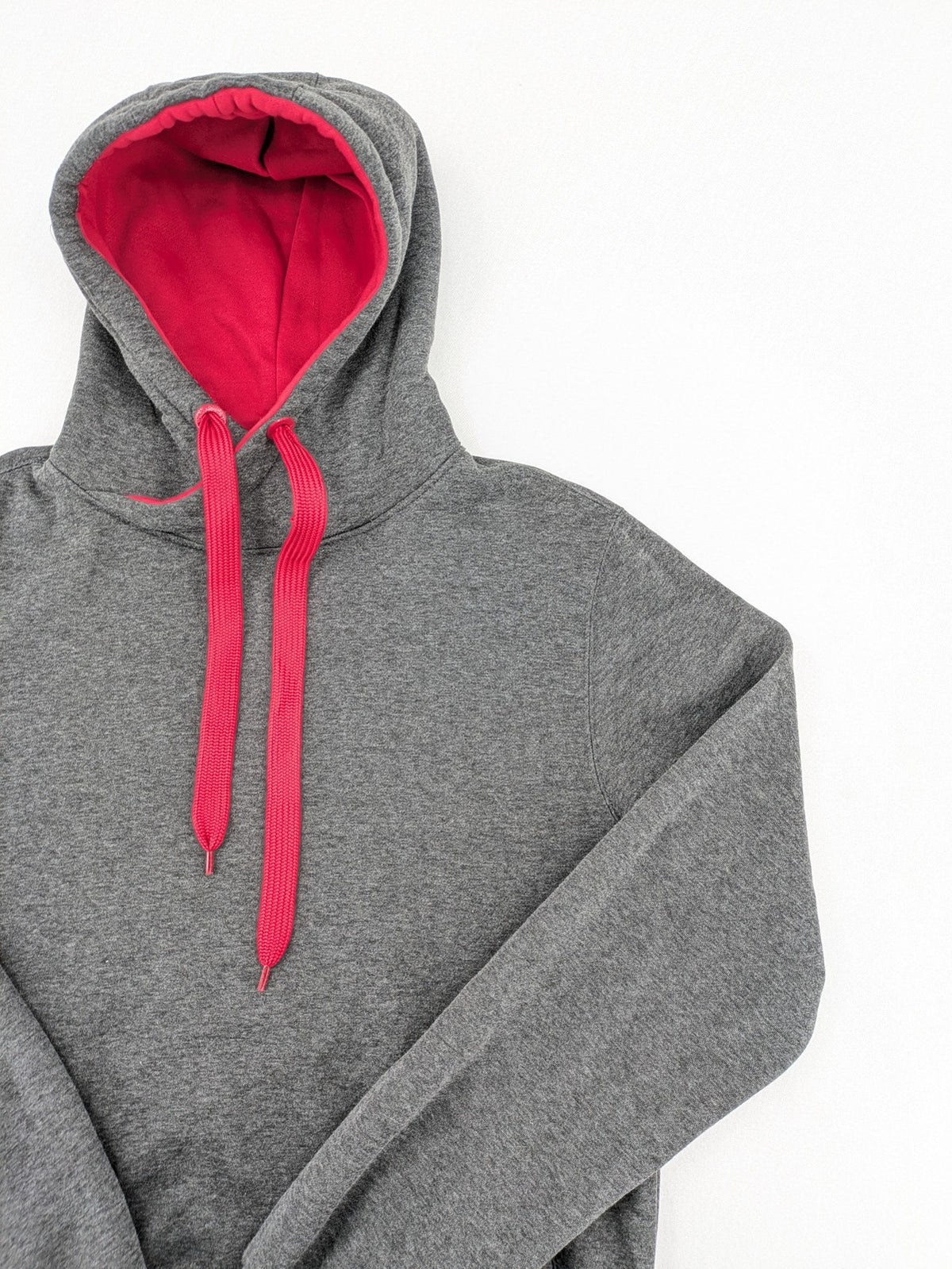 Bolf grey hoodie with pink contrast hood, kangaroo pocket, and ribbed cuffs.