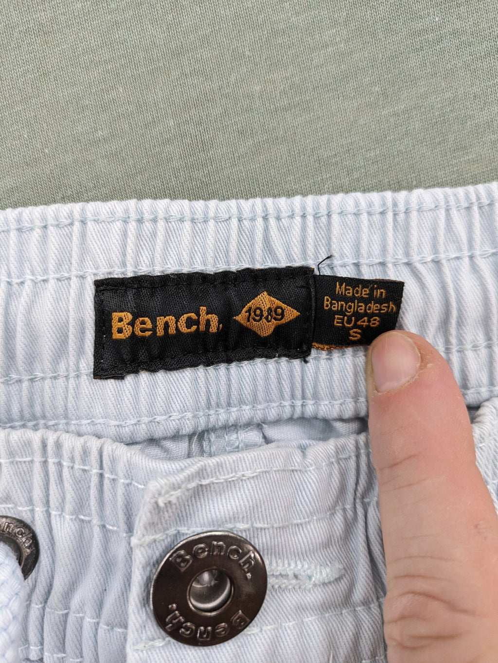 Bench blue shorts with elastic waistband, drawstring, and multiple pockets.