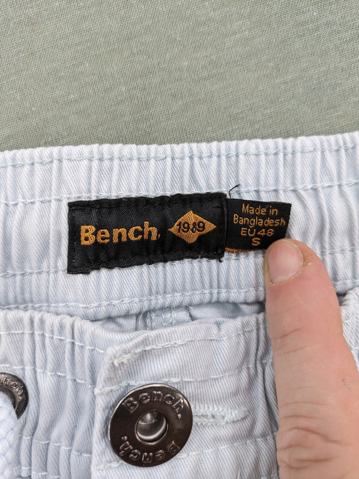 Bench blue shorts with elastic waistband, drawstring, and multiple pockets.