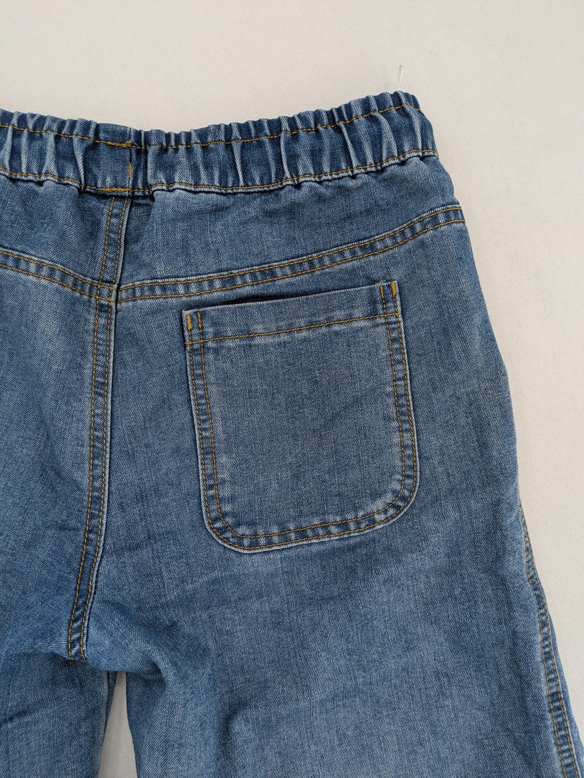 C&A blue denim shorts with elastic waistband and decorative drawstring, classic style.