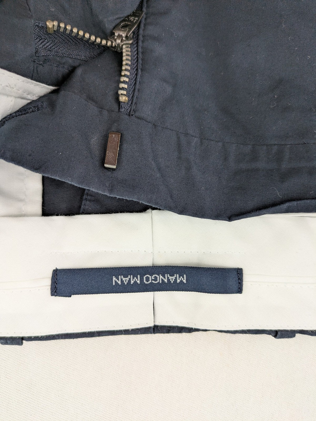 Mango Man black chinos flat front design with zipper and button closure.