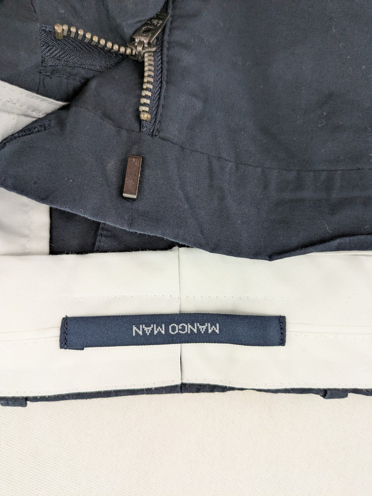 Mango Man black chinos flat front design with zipper and button closure.