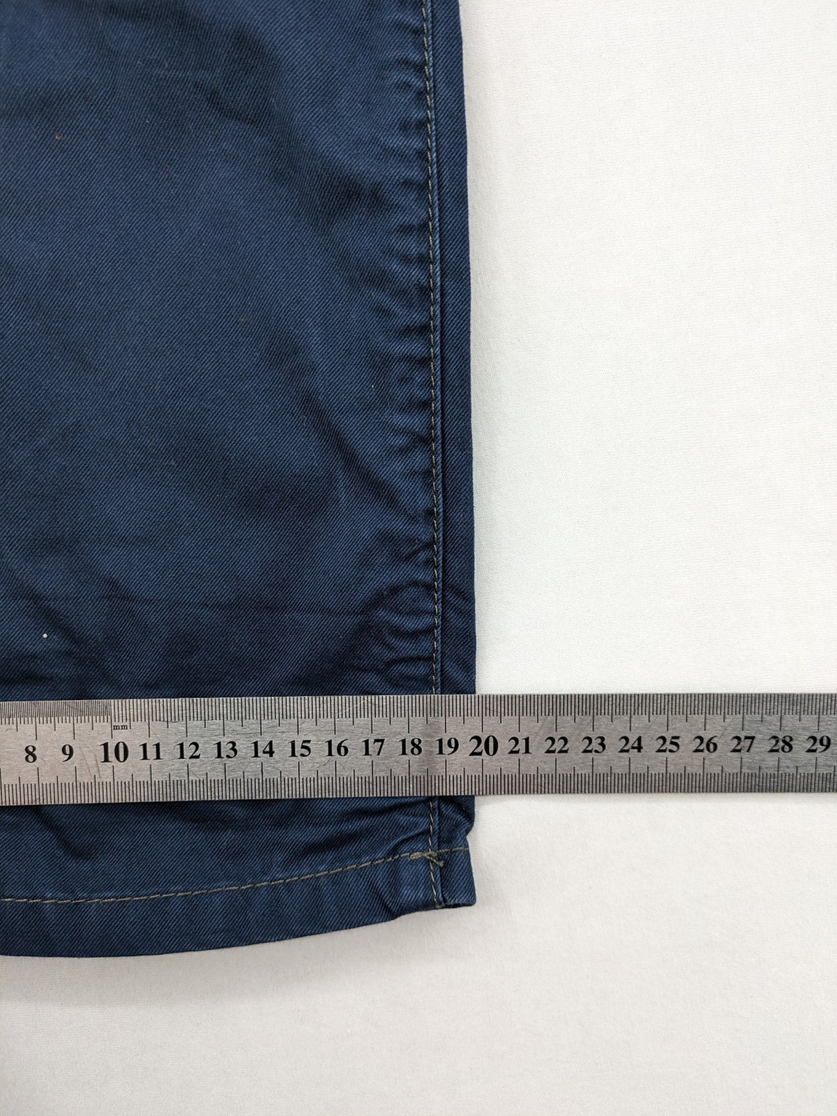Marc O'Polo blue chino pants with button flap pockets and relaxed fit design.