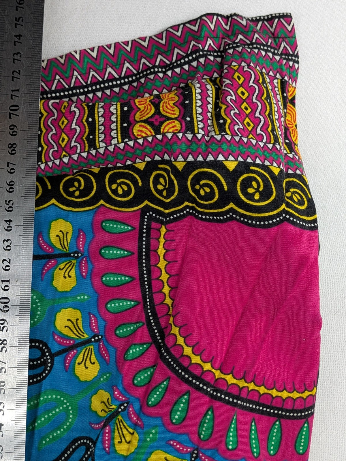 M/L multi Dashiki shirt with vibrant ethnic print on light blue cotton fabric.