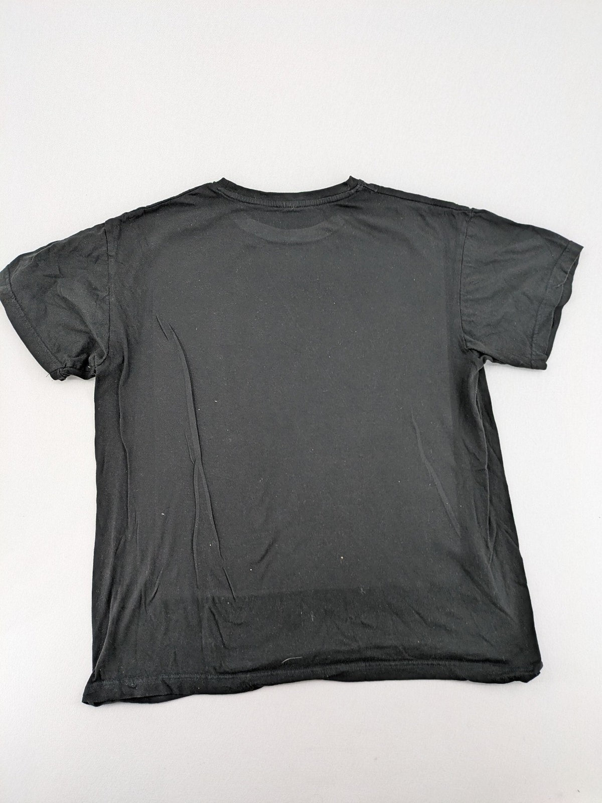 Dragon Ball Z black t-shirt featuring Goku Sport logo and silhouette on Flying Nimbus.