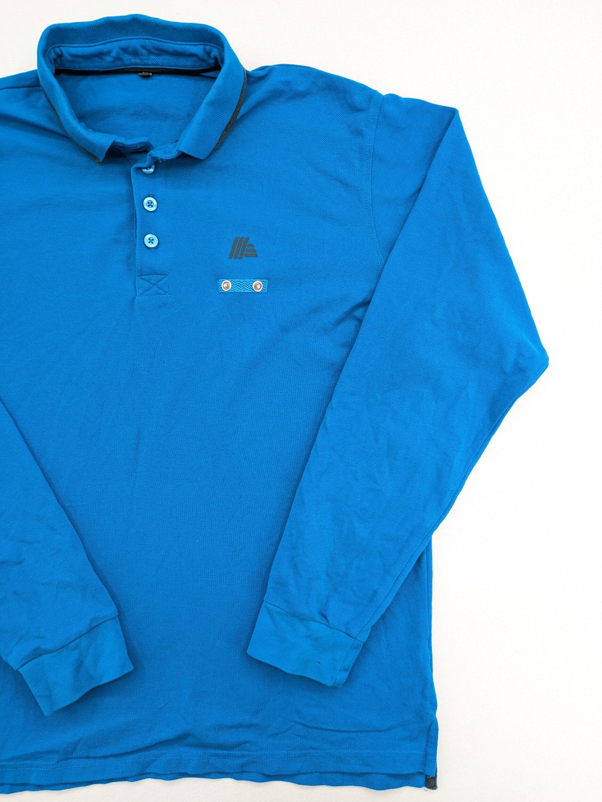 Aldi blue long sleeve polo shirt with embroidered logo and classic collar.