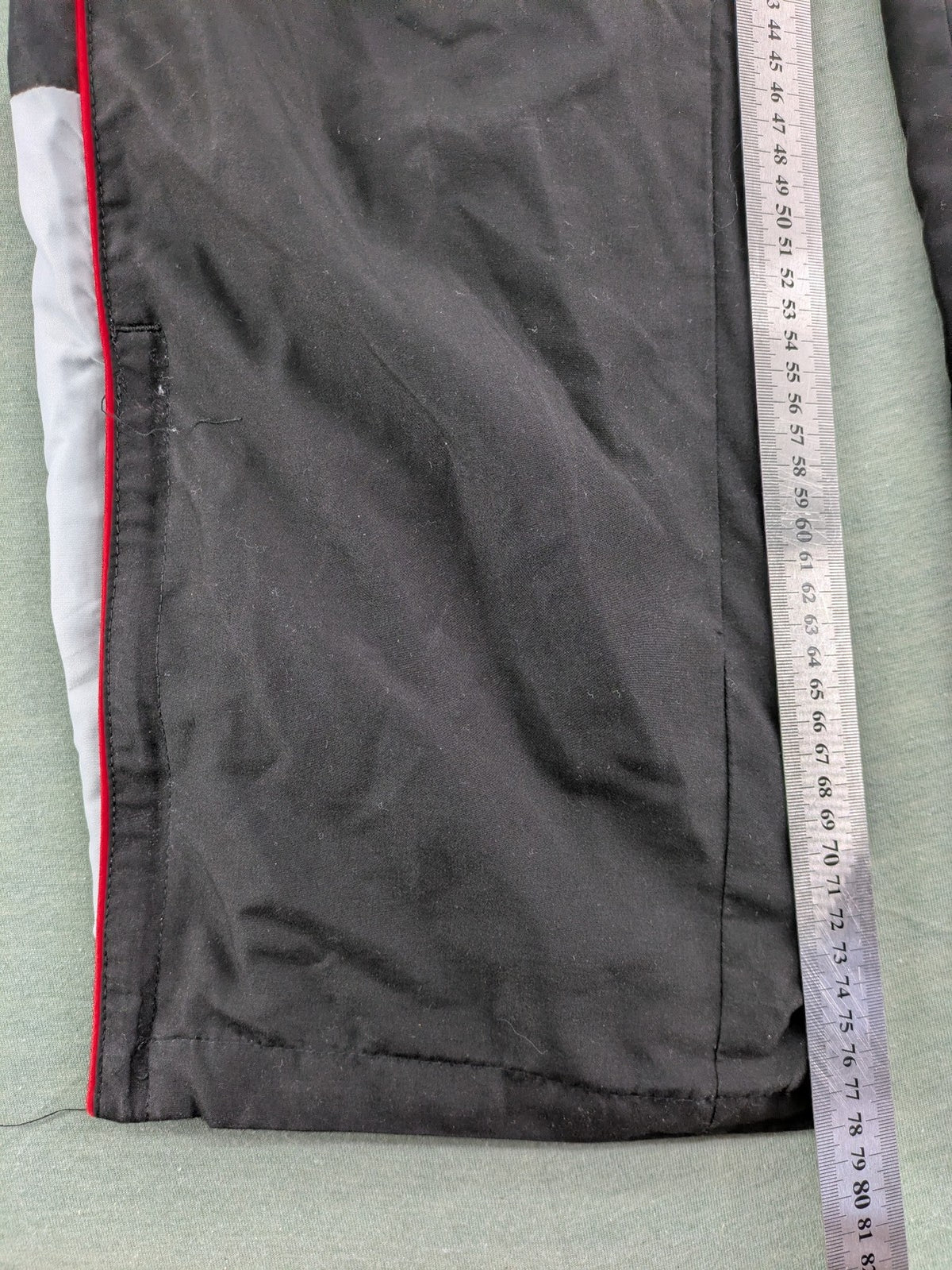 Fila grey jogging pants with red piping and embroidered logo on thigh.