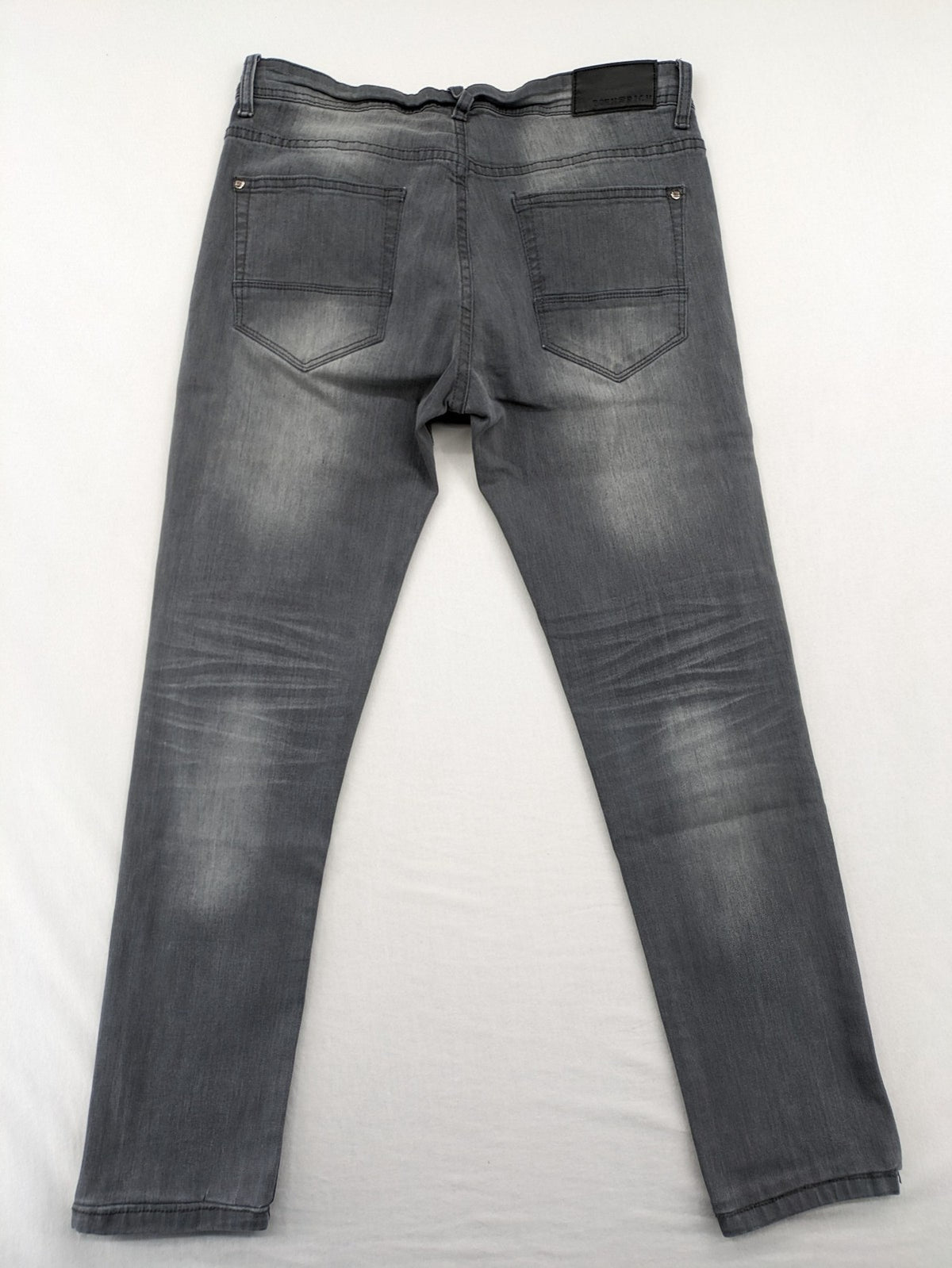 Born Rich grey slim fit jeans with button fly and washed denim texture.