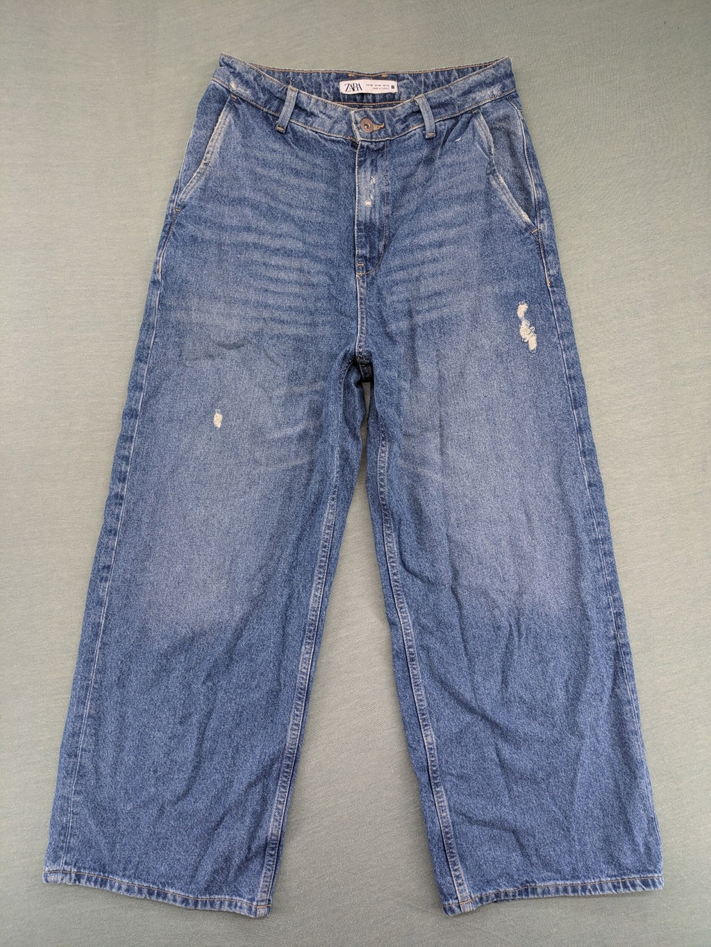 Zara blue wide leg jeans high rise with distressed details and 5-pocket design.