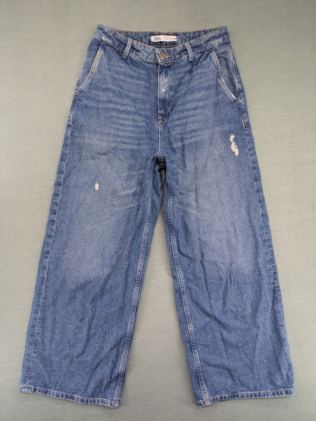 Zara blue wide leg jeans high rise with distressed details and 5-pocket design.
