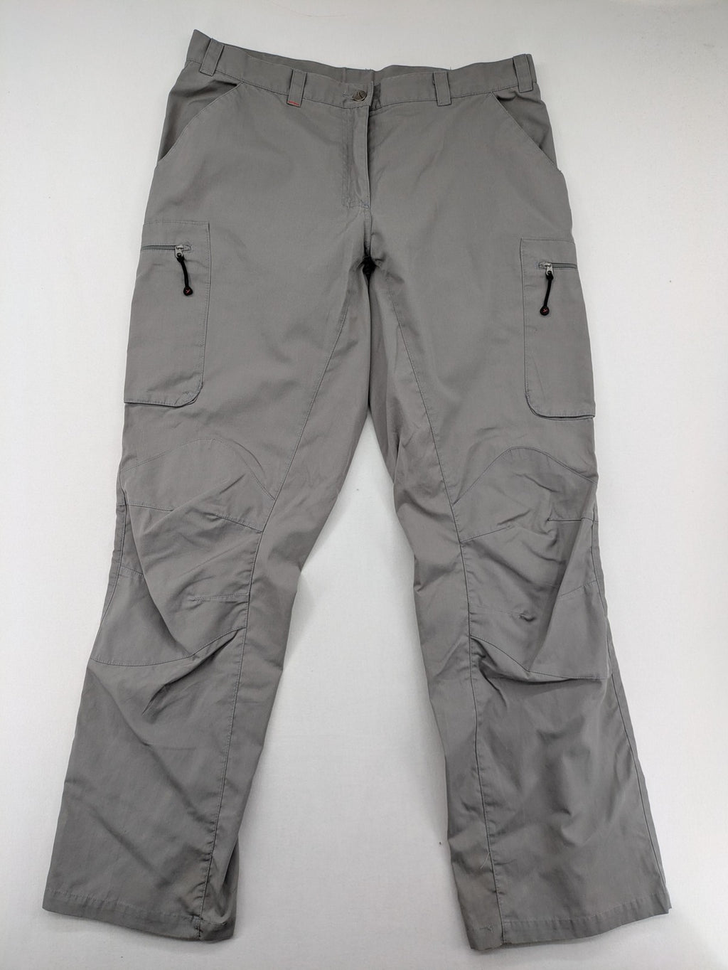 YETI grey cargo pants with multiple zippered pockets and durable material.