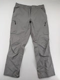 YETI grey cargo pants with multiple zippered pockets and durable material.