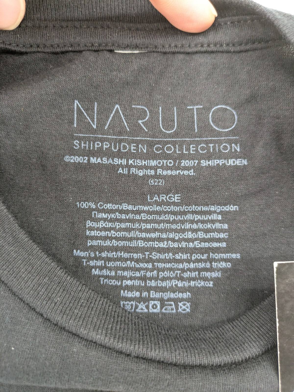 Naruto Shippuden black graphic t-shirt featuring colorful Naruto Uzumaki design, 100% cotton.