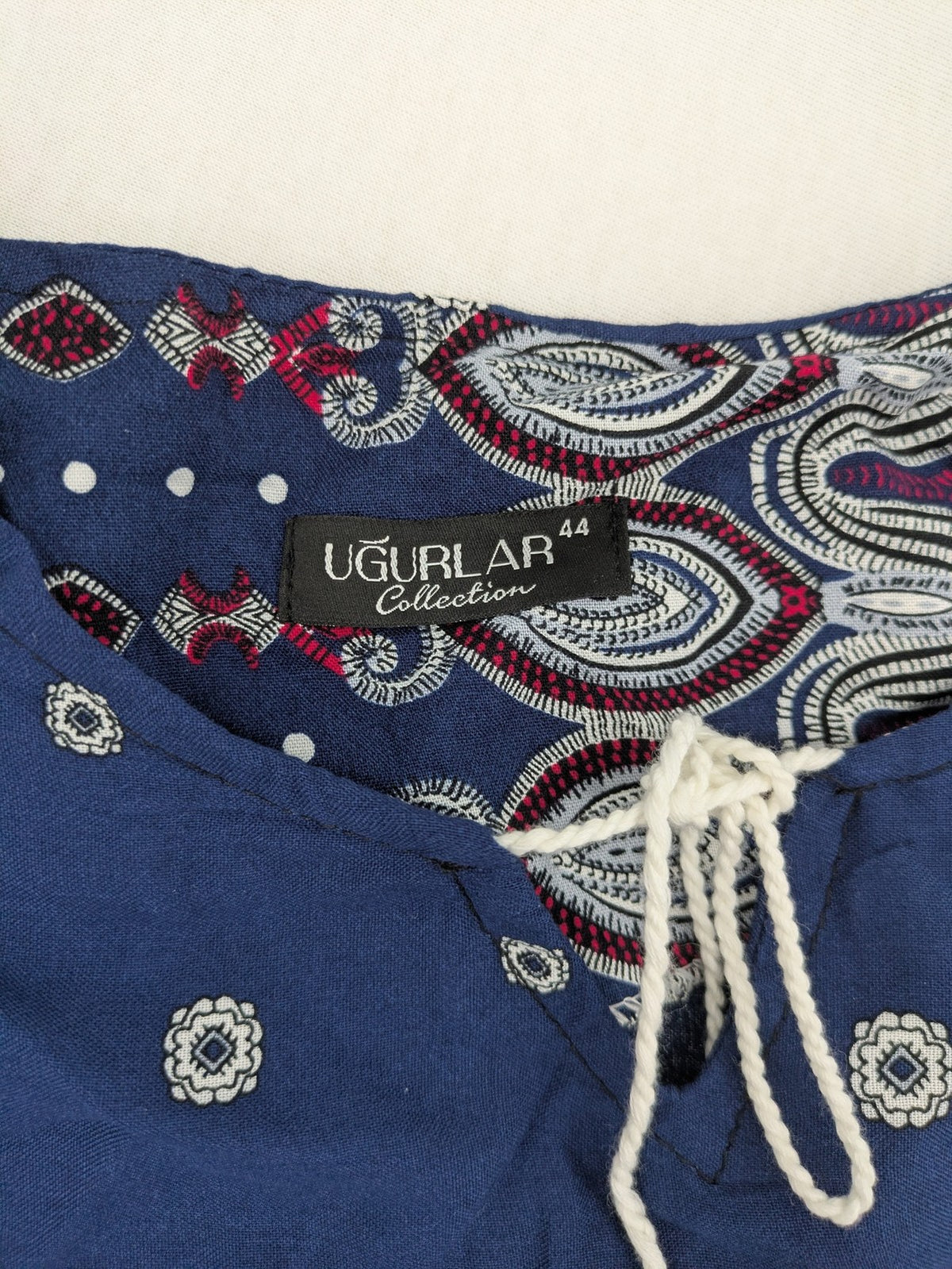 Uğurlar Collection multi tunic dress with vibrant Boho-Ethno pattern and V-neck tassel detail.