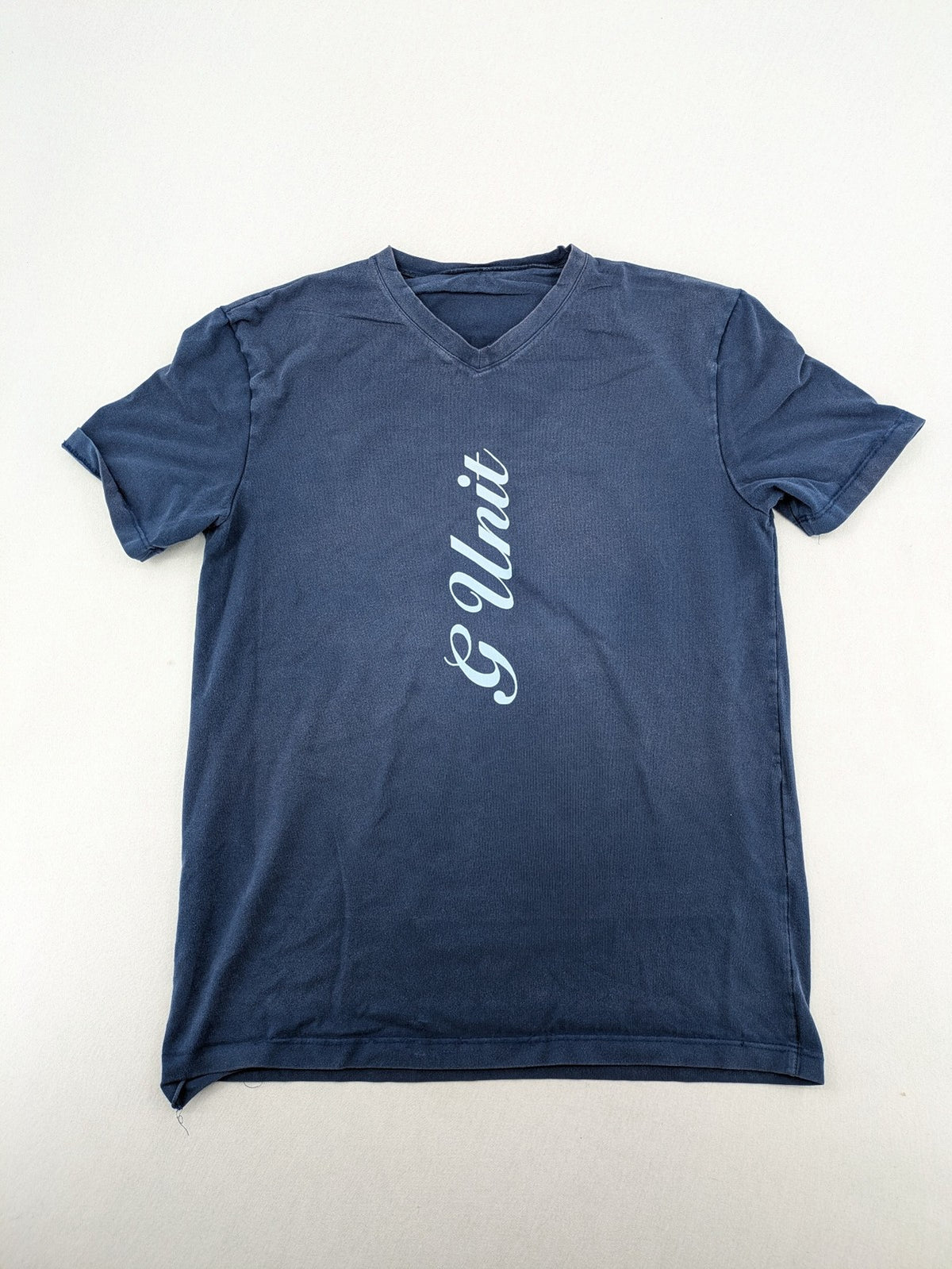 G-Unit navy vintage T-shirt with vertical logo print and V-neck design.
