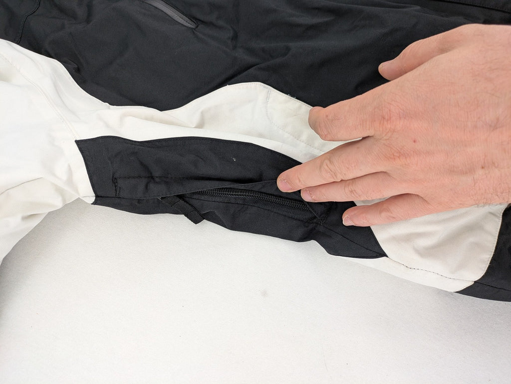 Icepeak black and white ski snowboard jacket with RECCO logo and quilted insulation.