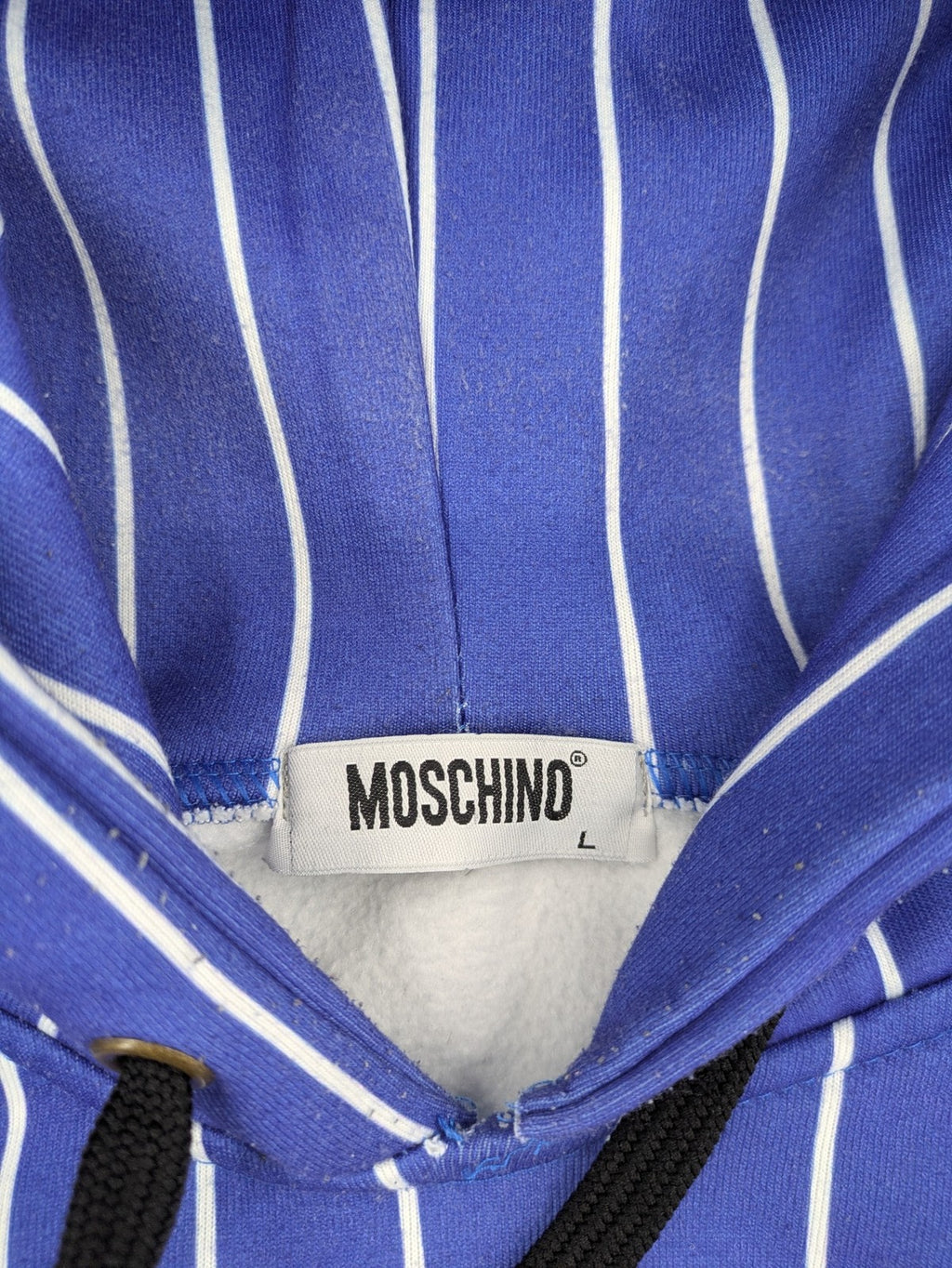 Moschino multi turtle neck jumper blue and white striped with Tasmanian Devil graphic.