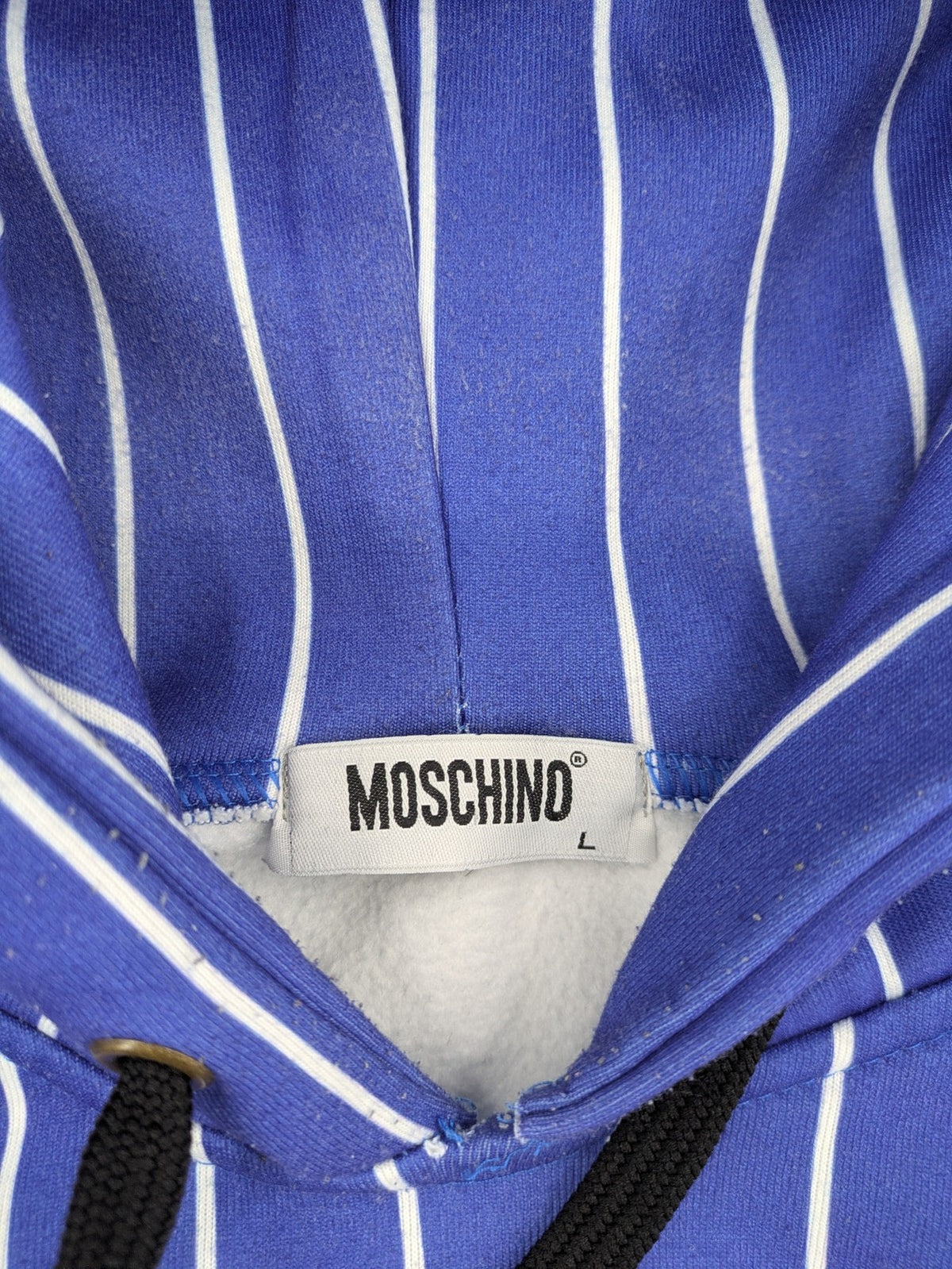 Moschino multi turtle neck jumper blue and white striped with Tasmanian Devil graphic.
