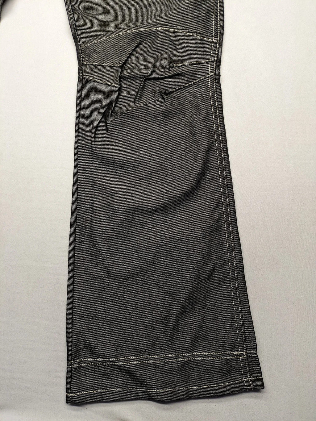CIPO grey bootcut biker jeans with white contrast stitching and moto-inspired knee pleats.