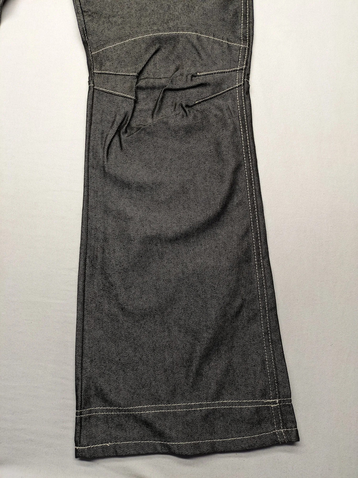 CIPO grey bootcut biker jeans with white contrast stitching and moto-inspired knee pleats.