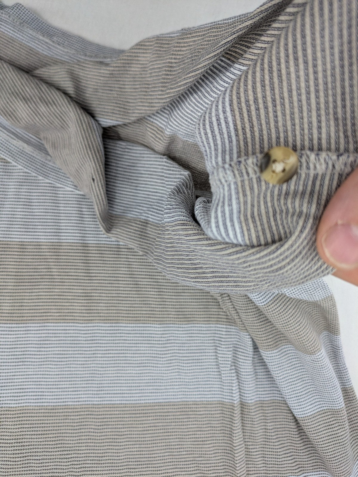 Mark Scot Collection grey and tan striped polo shirt with classic collar and logo.