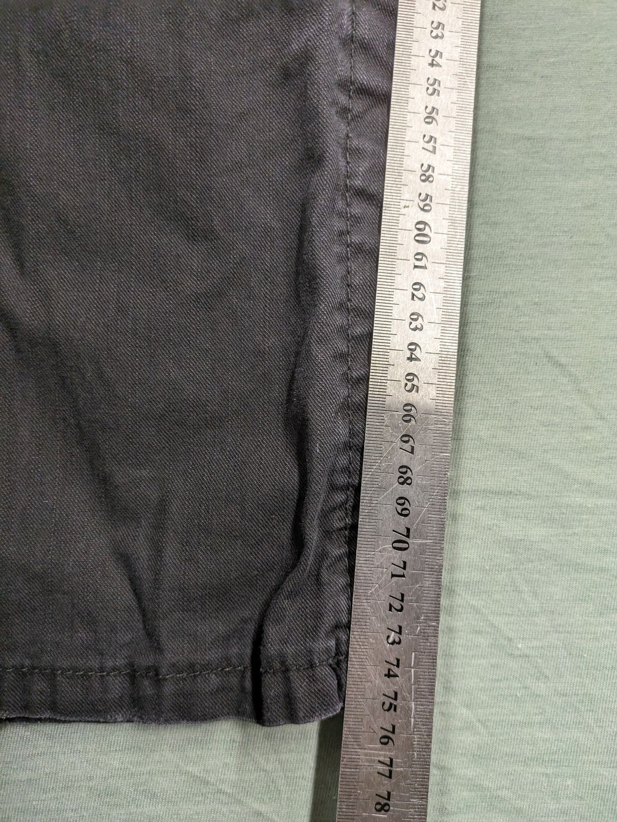Savvy black pants straight fit with button fly, embroidered details and unique stitching.