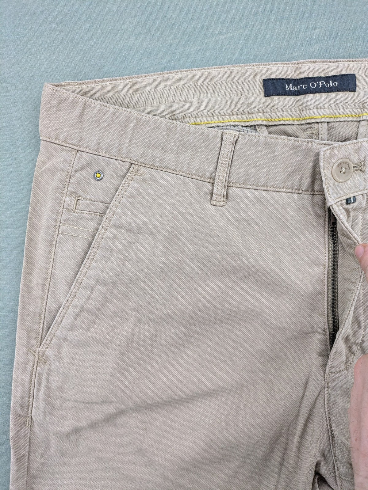 Marc O'Polo beige tapered fit chino pants, soft cotton stretch fabric, modern silhouette.