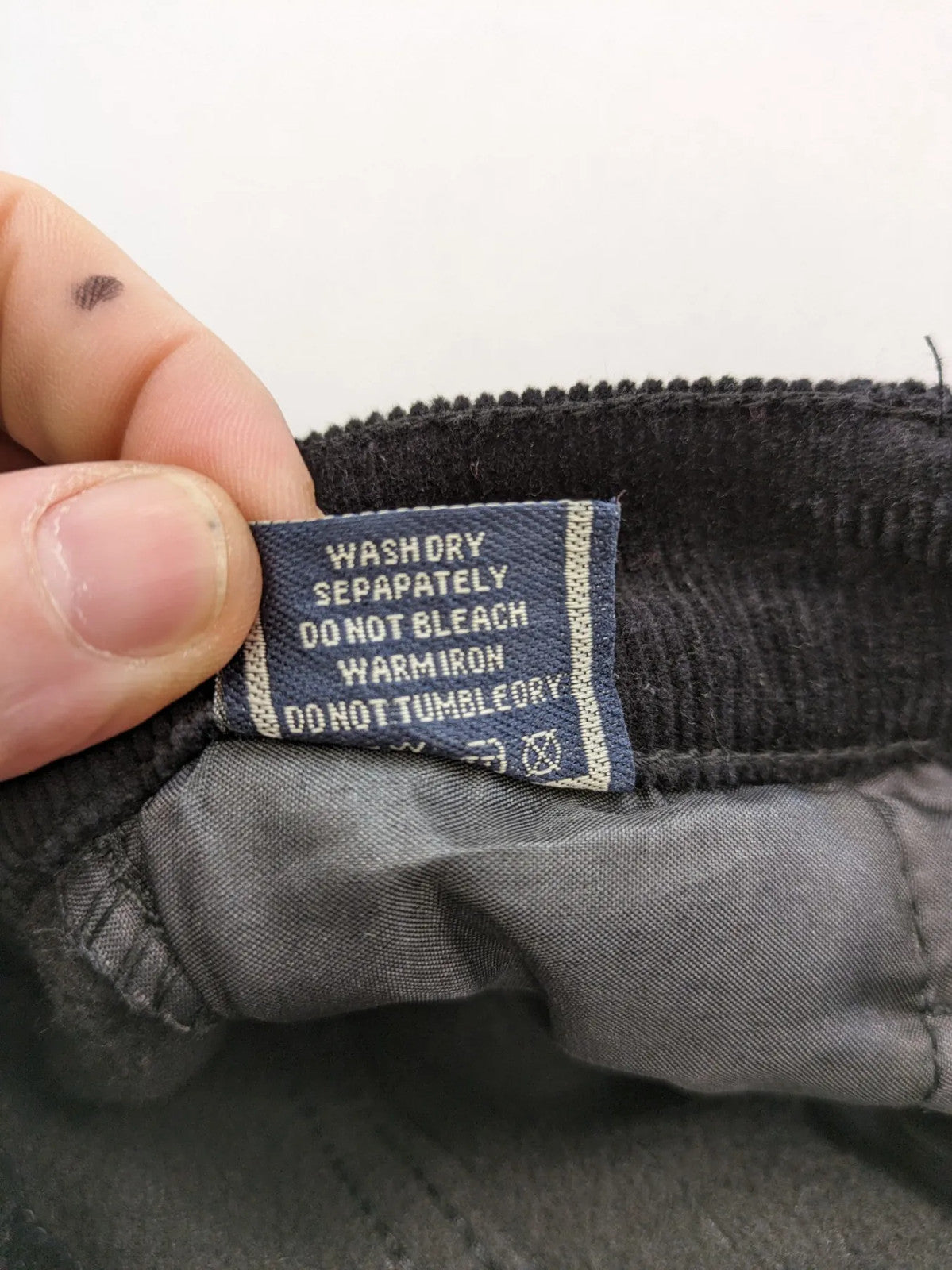 Tomfear black straight fit cord jeans, classic five-pocket design, soft corduroy material.