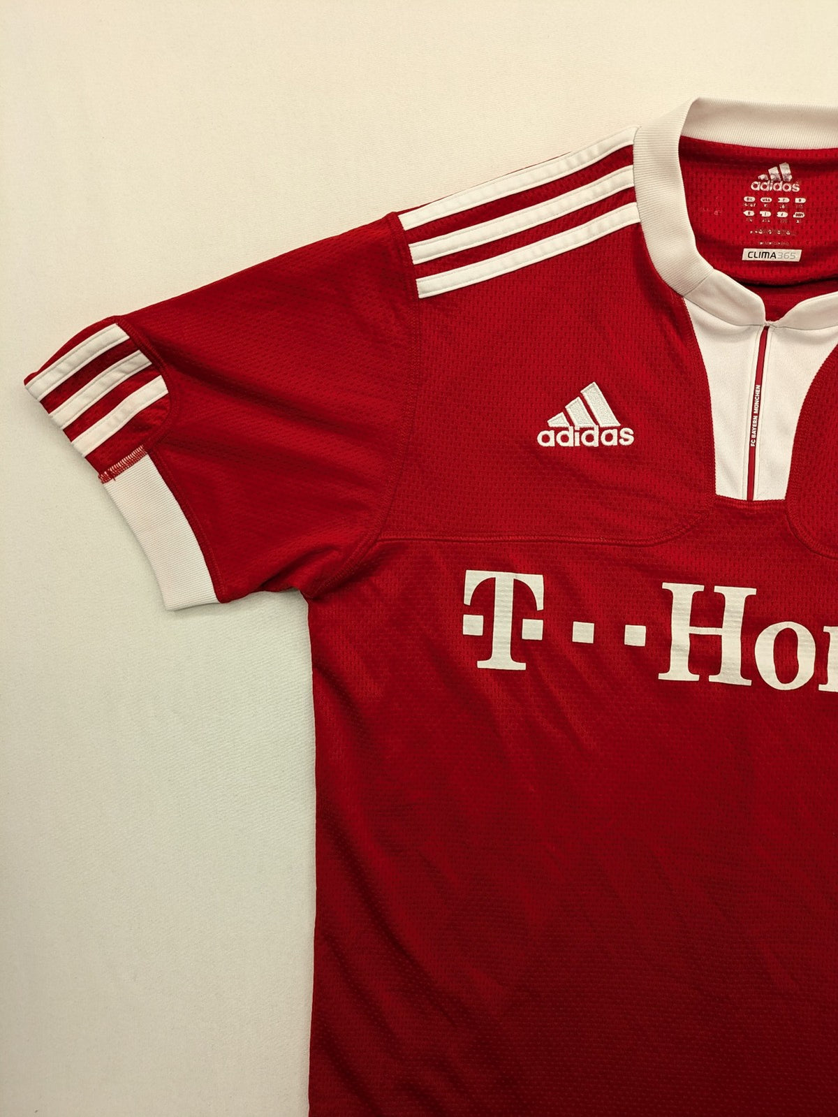 Adidas red soccer uniform with T-Home logo and embroidered FC Bayern München crest.