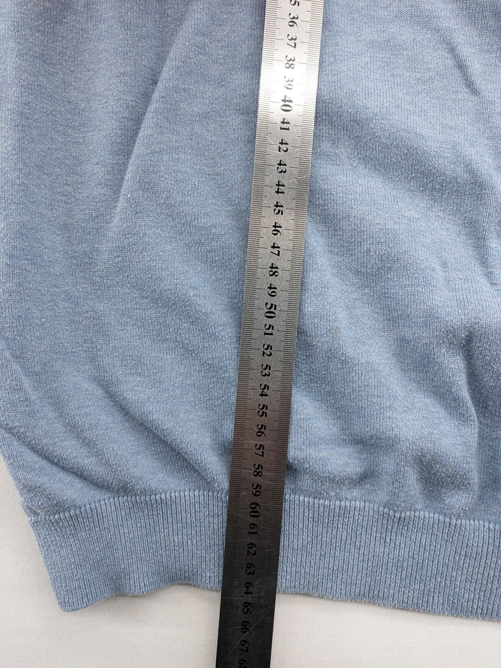 BRAX blue turtle neck jumper with V-neck and subtle "X" logo embroidery.