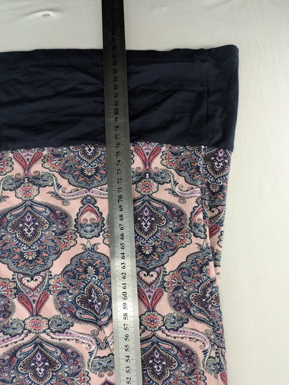 Montego pink sleeveless dress with paisley pattern and black hem, made of viscose.