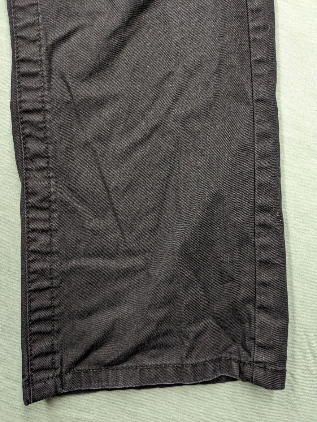 Savvy black pants straight fit with button fly, embroidered details and unique stitching.