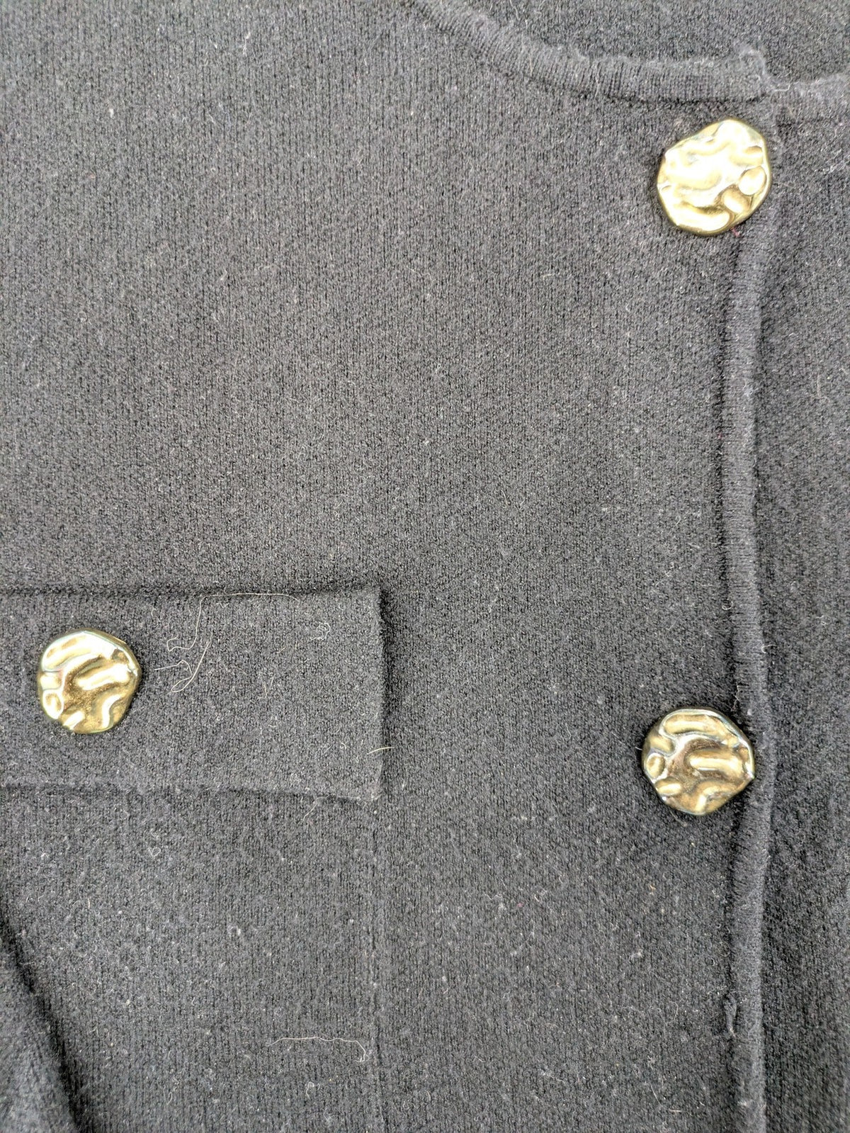 Reserved gold turtle neck jumper with black knit, gold button details and front pockets.