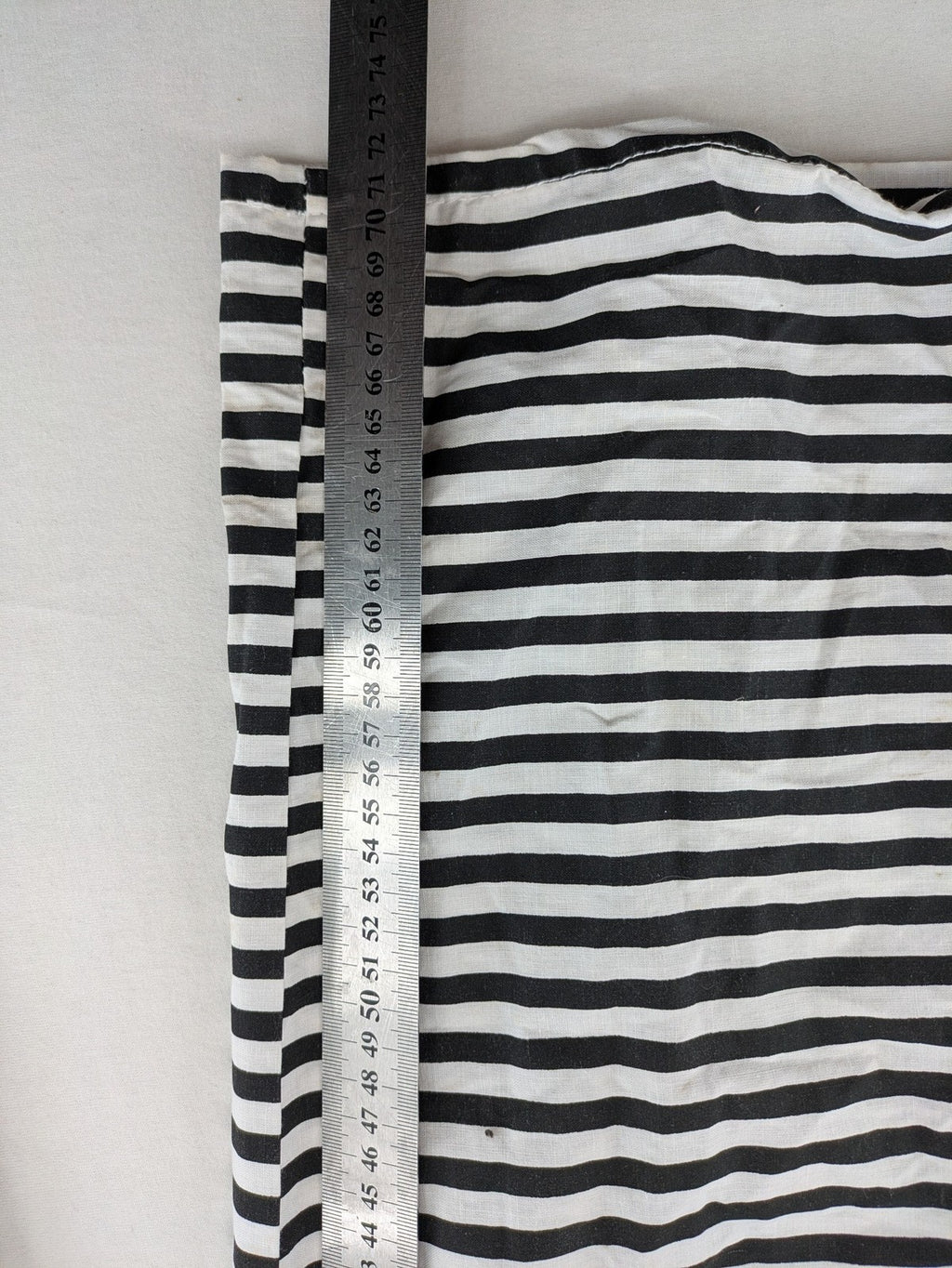 Rubie's costume set black and white striped with prisoner number patch on chest.