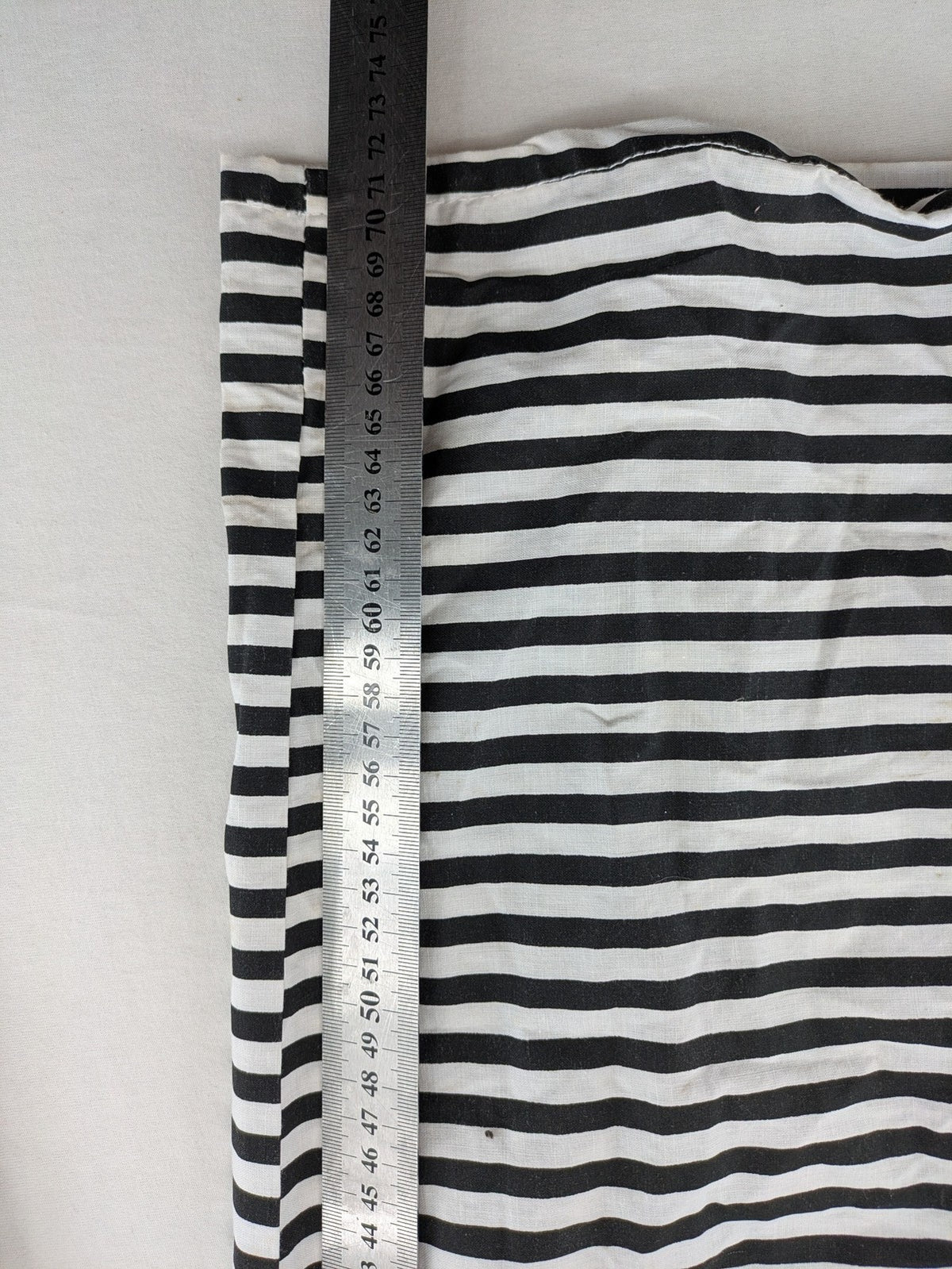 Rubie's costume set black and white striped with prisoner number patch on chest.