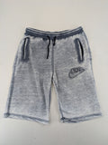 Nike grey acid wash jogger shorts with embossed logo and zip pockets.