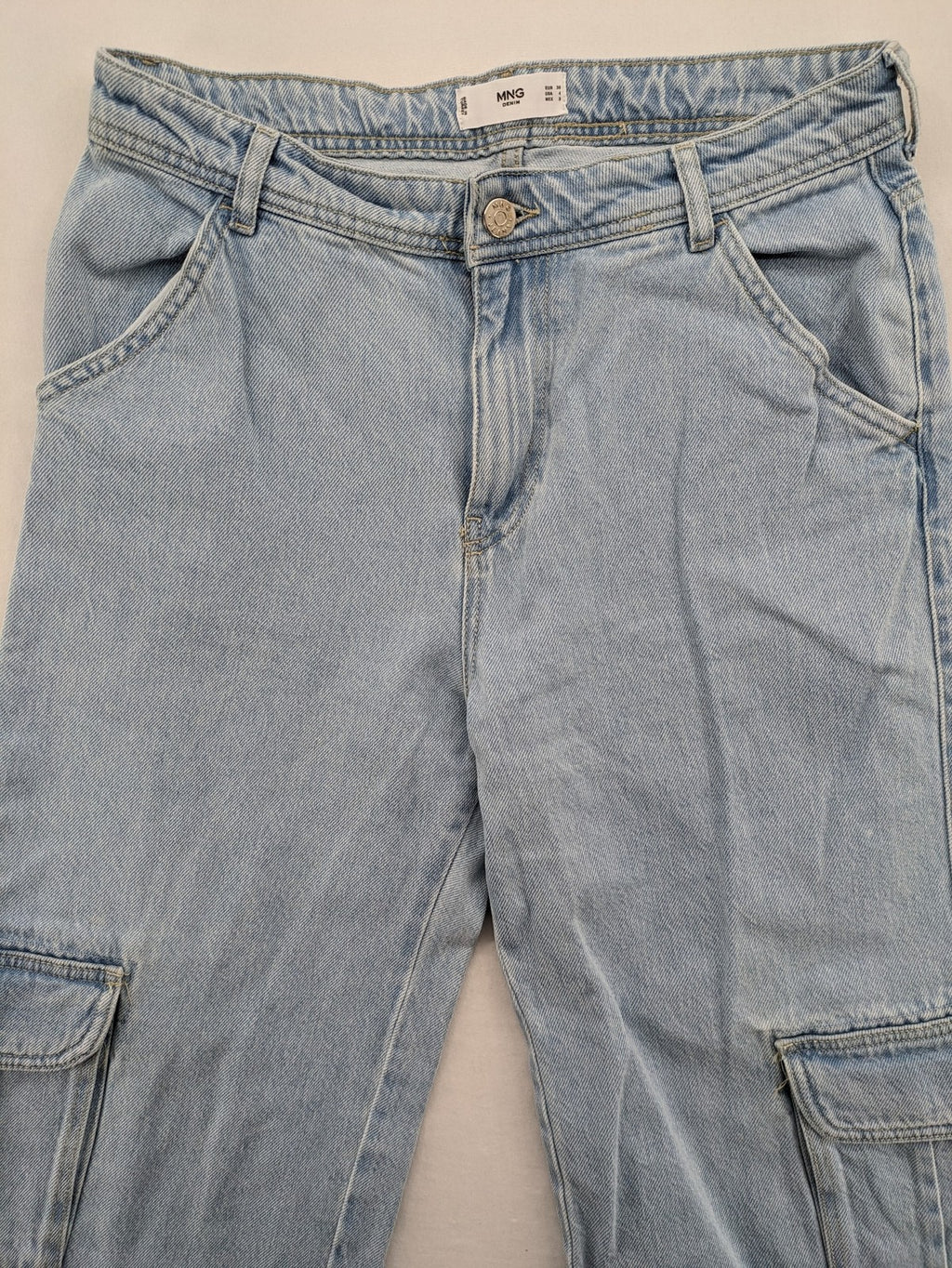 MNG blue straight jeans with cargo pockets and raw hem, high waist denim.